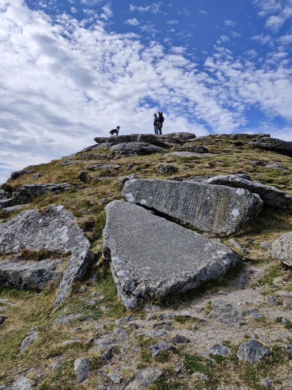Walkers on Buckland Beacon above the Ten Commandments stones